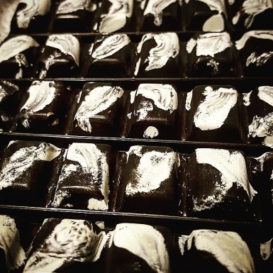 Black and white hand shelled hand painted chocolate bar